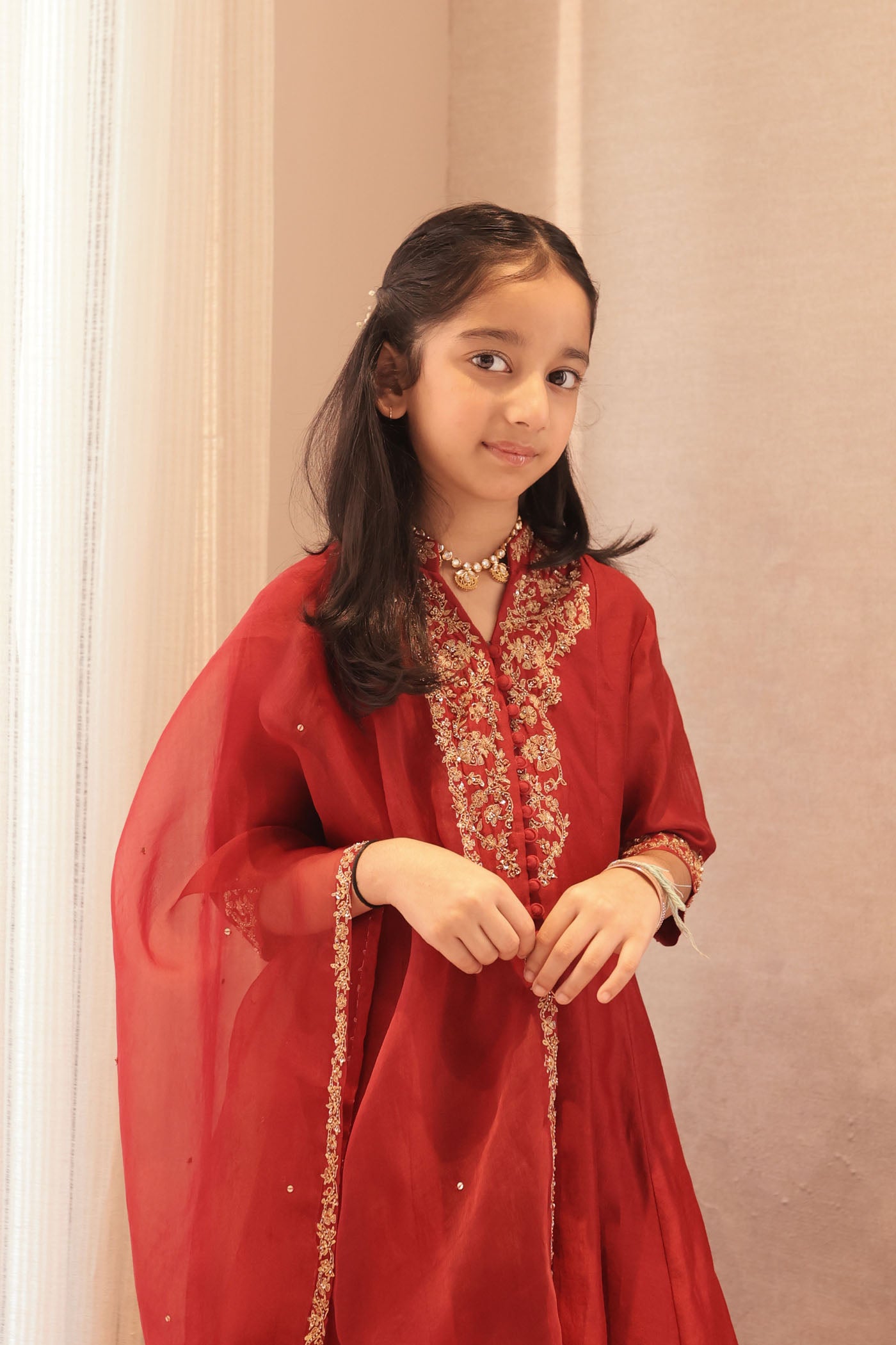 Maroon silk kurta set with intricate borders