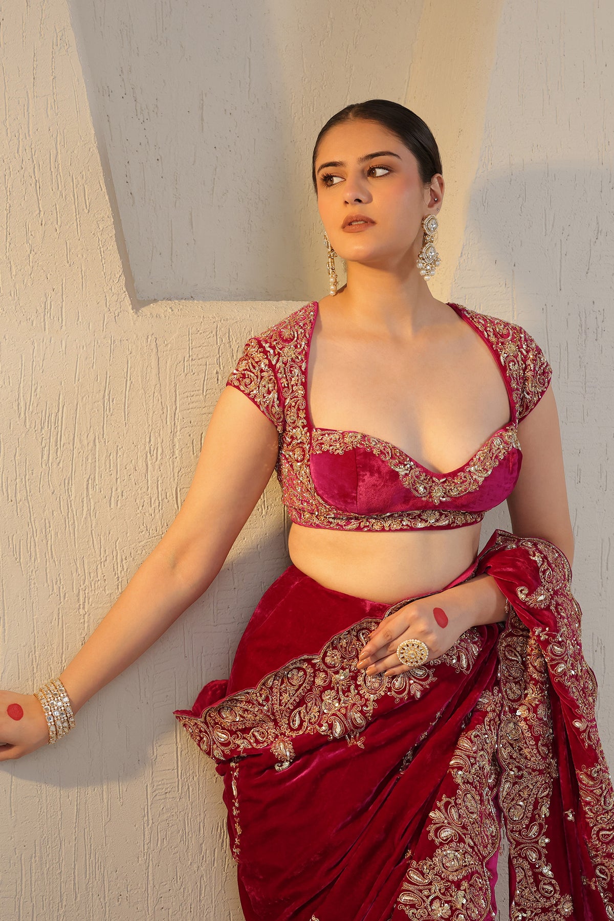 Hot pink velvet saree with gold embroidery