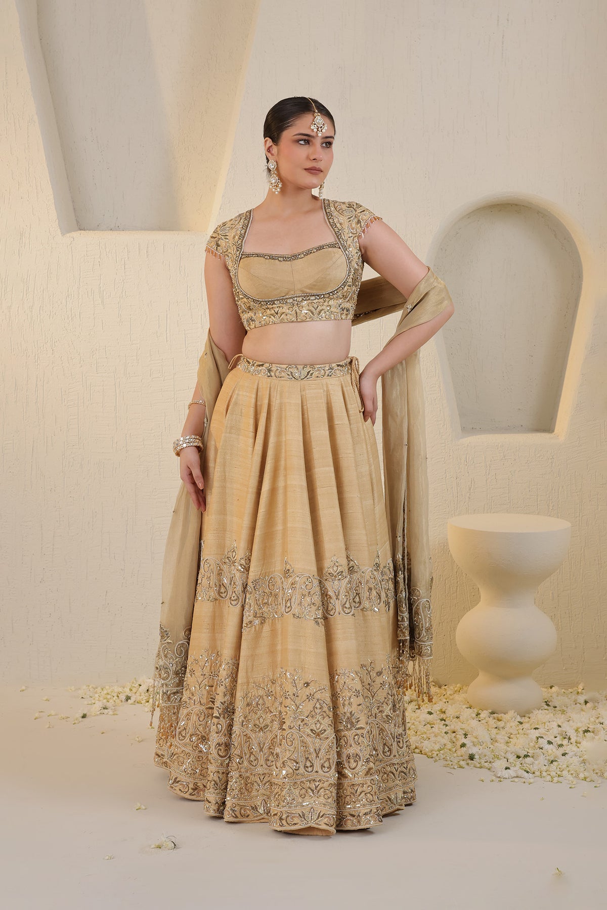 Champagne gold silk lehenga with gold embellishments