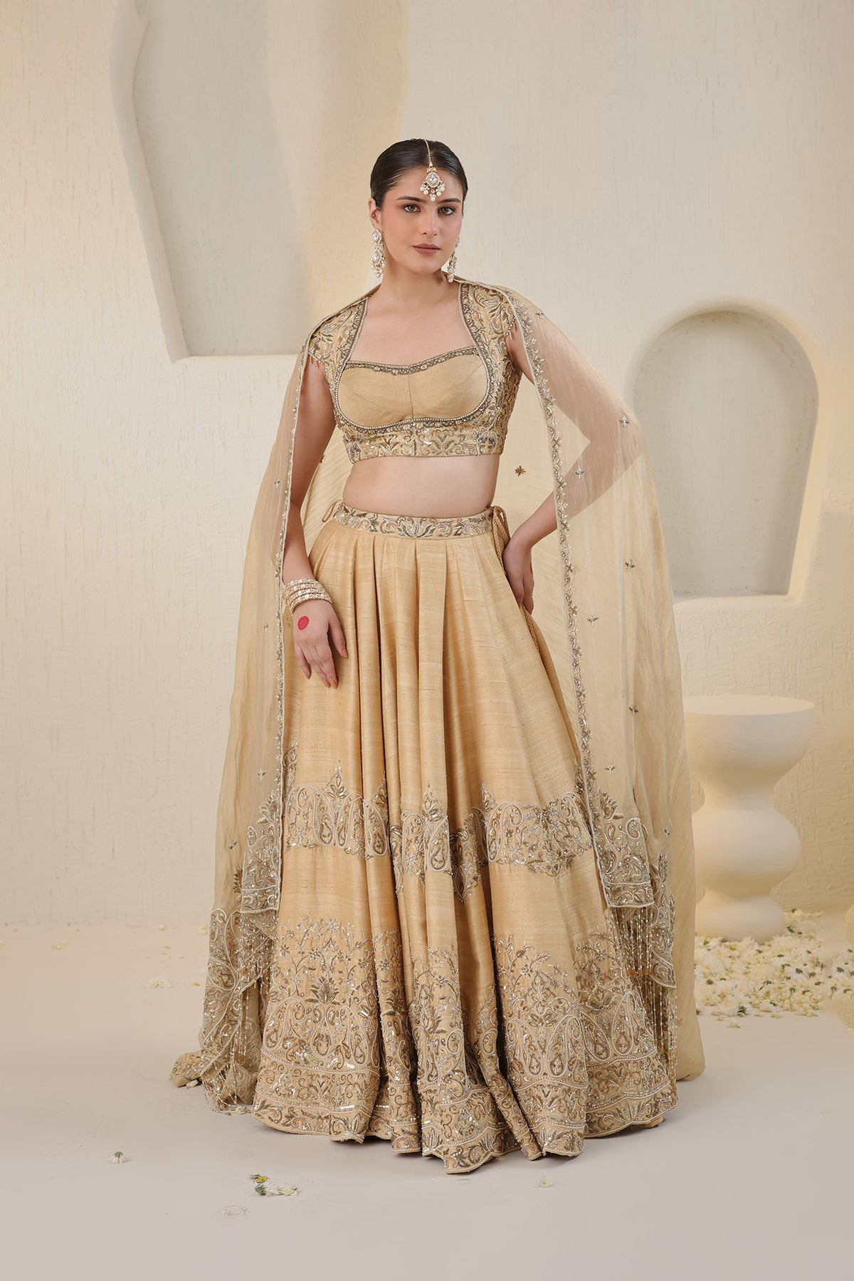 Champagne gold silk lehenga with gold embellishments