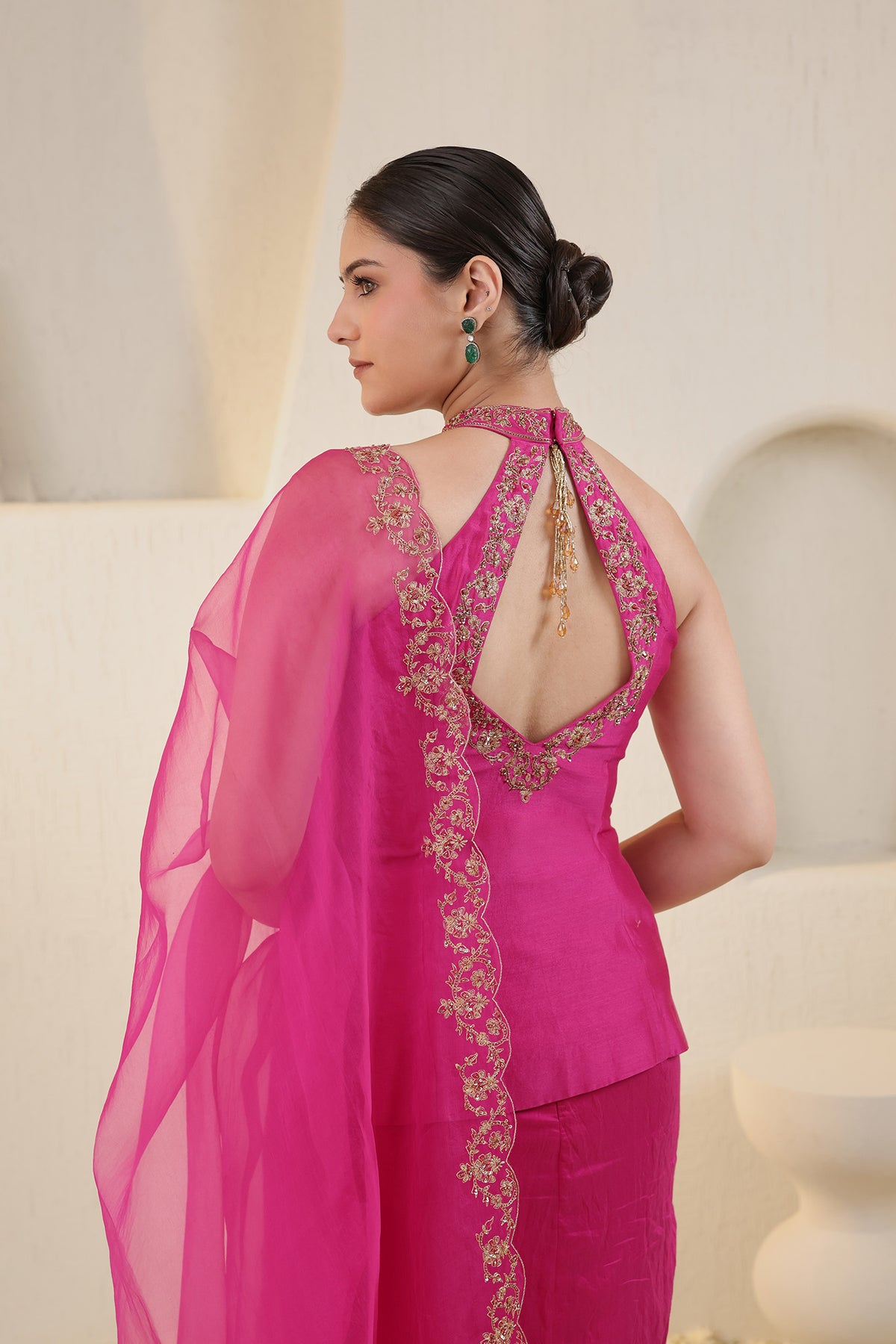 Fushia pink halter neck silk ensemble with embroidered dupatta