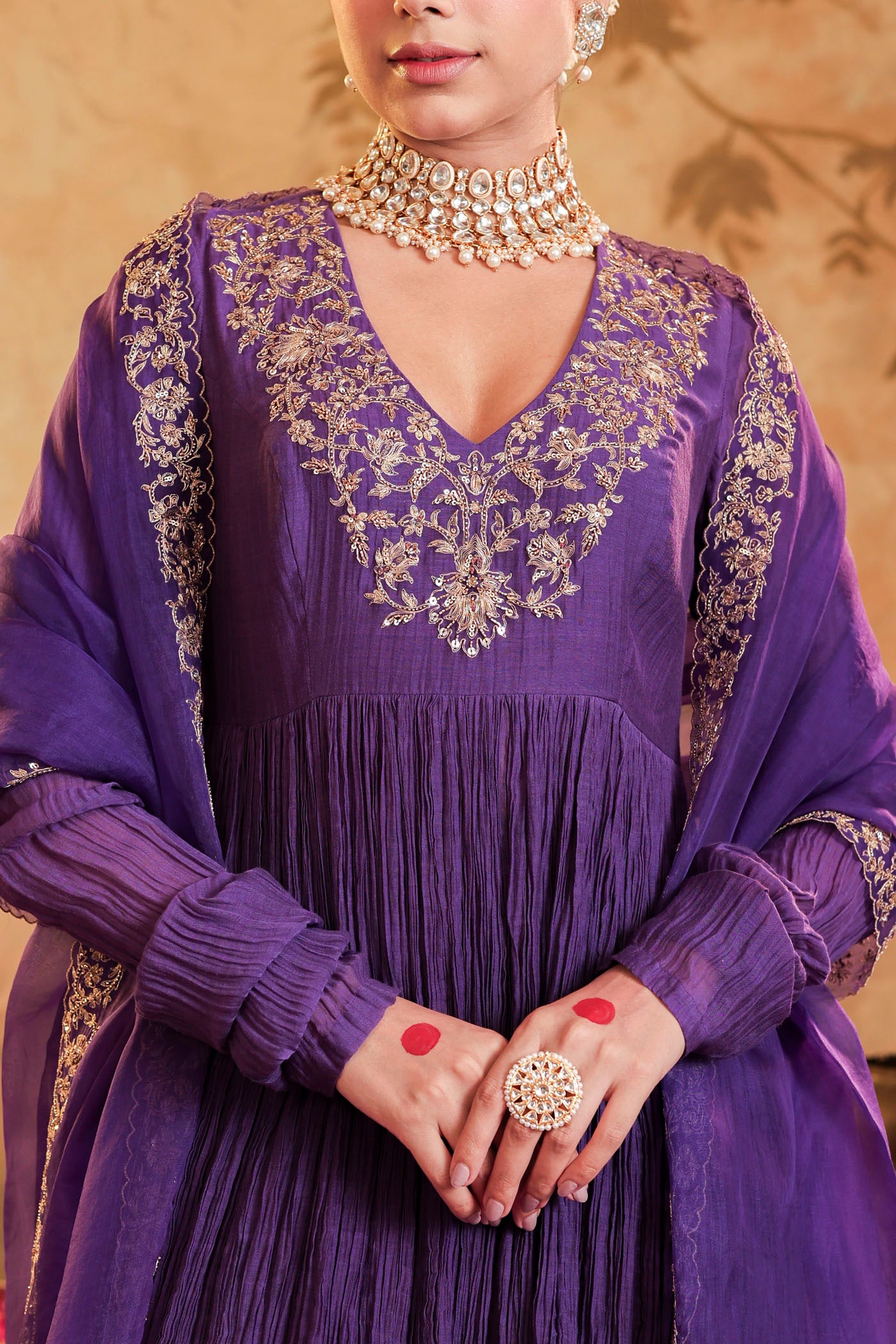 Royal purple anarkali woven with golden dreams