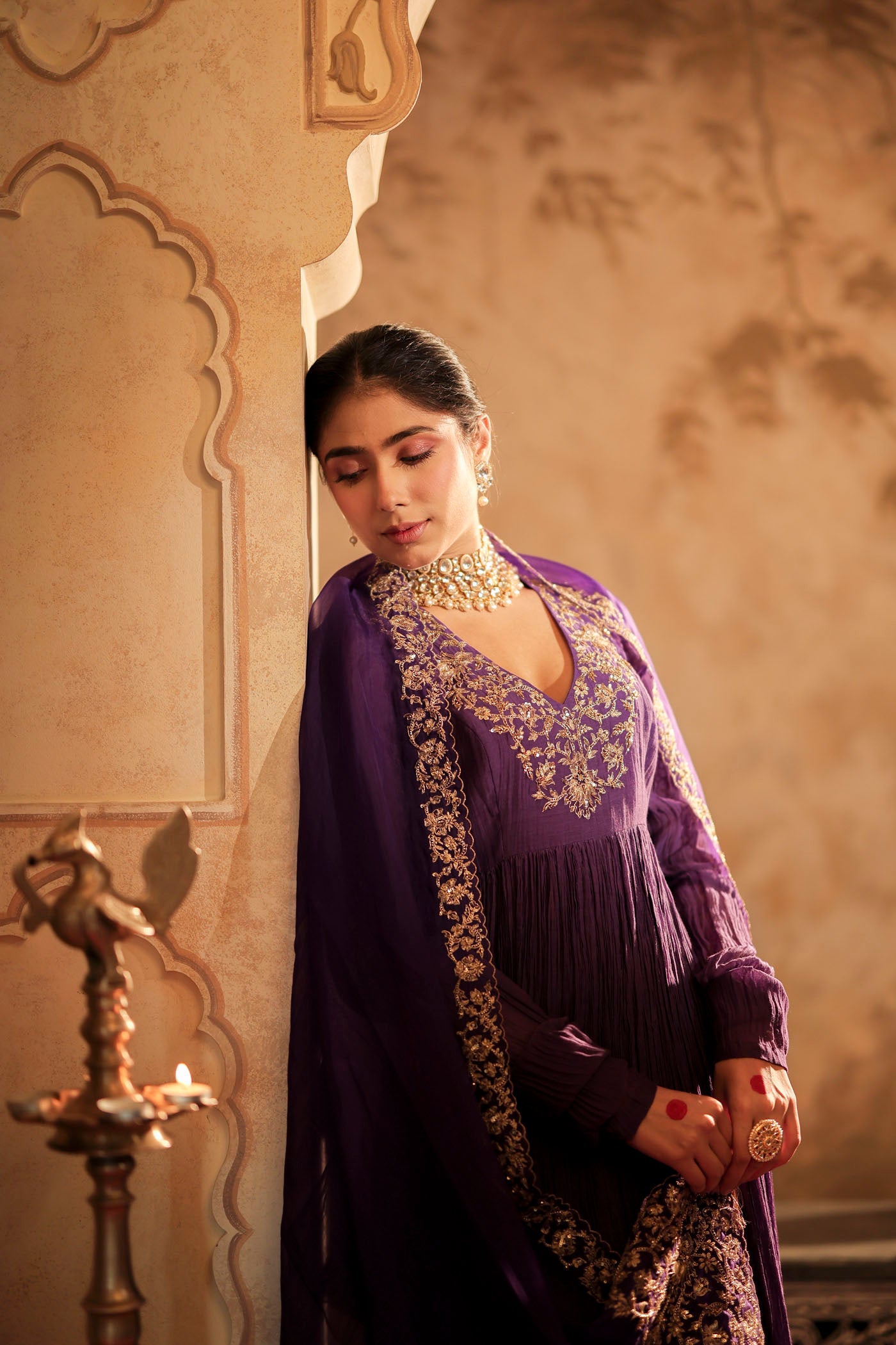 Royal purple anarkali woven with golden dreams