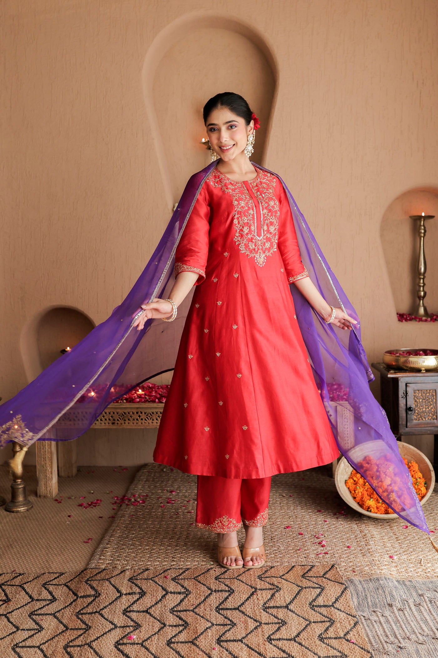 Red kurta set with purple dupatta and fine embellishments
