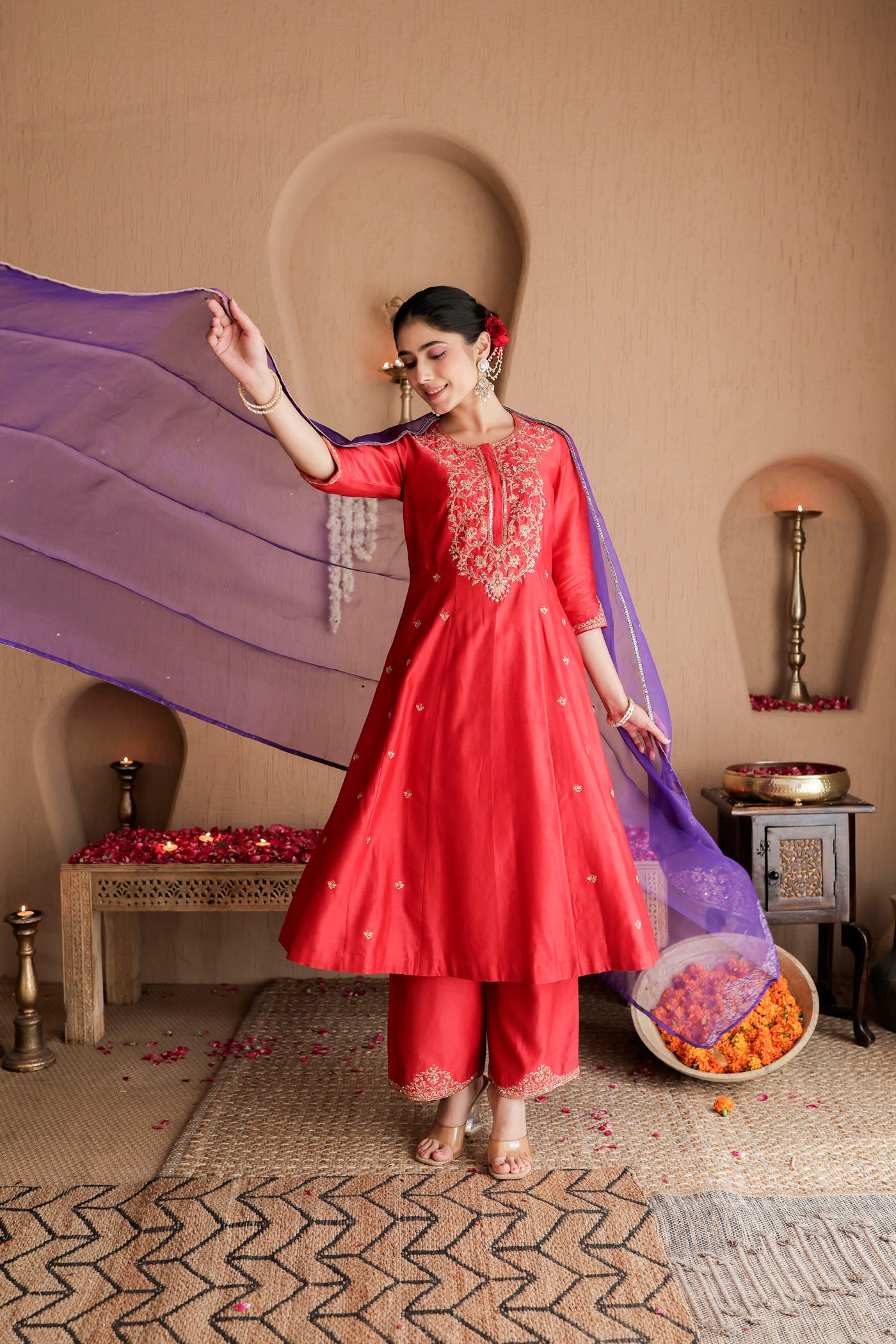 Red kurta set with purple dupatta and fine embellishments