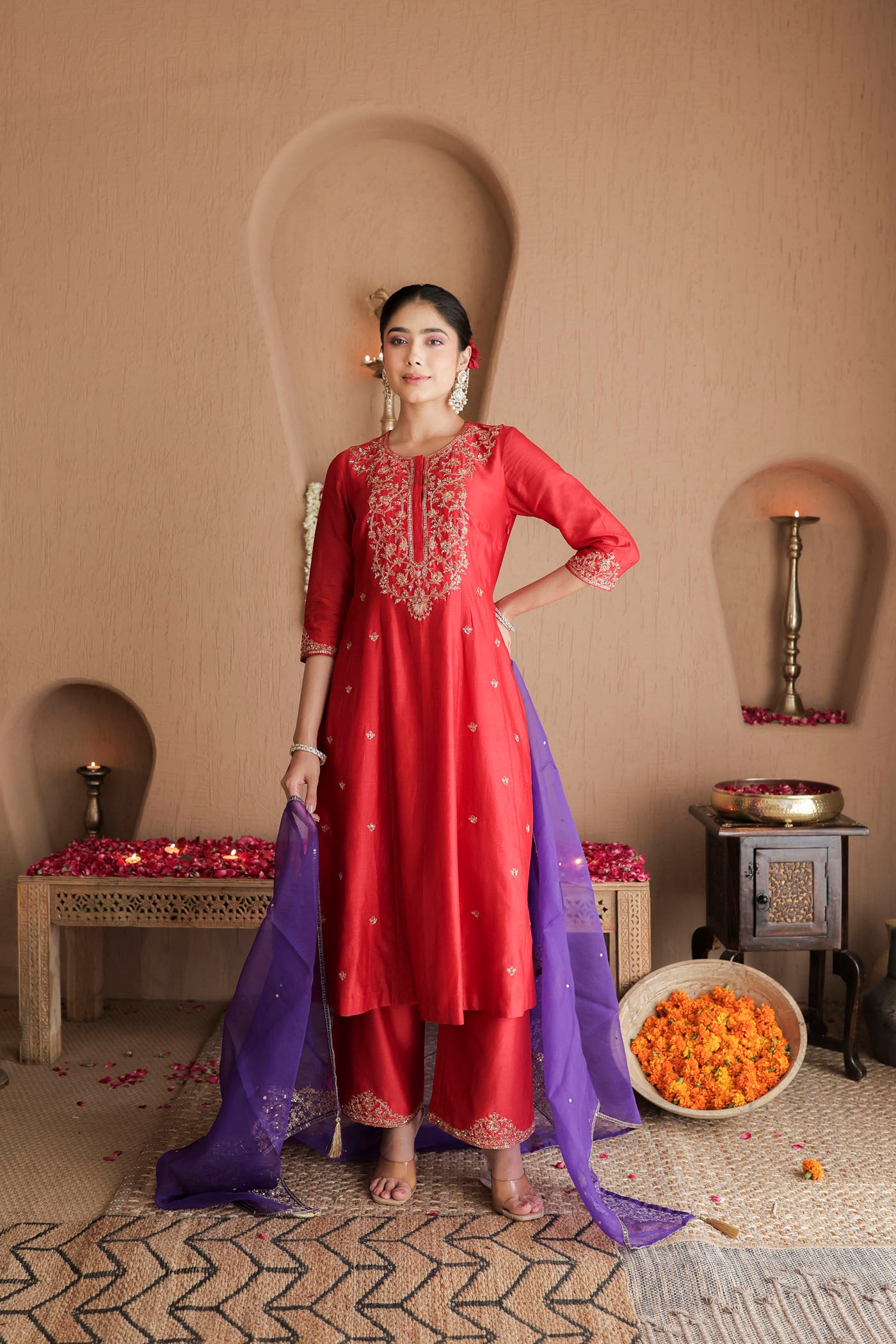 Red kurta set with purple dupatta and fine embellishments