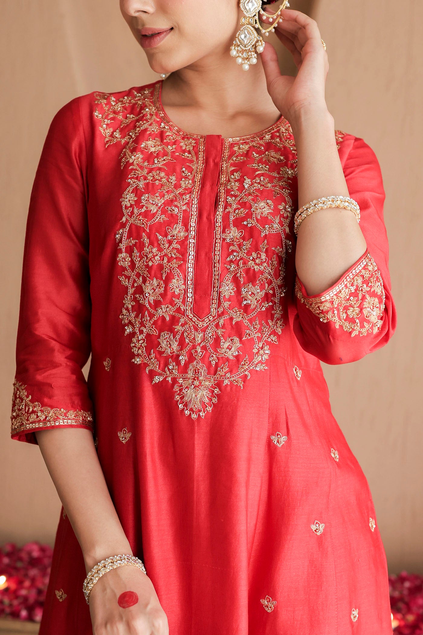 Red kurta set with purple dupatta and fine embellishments