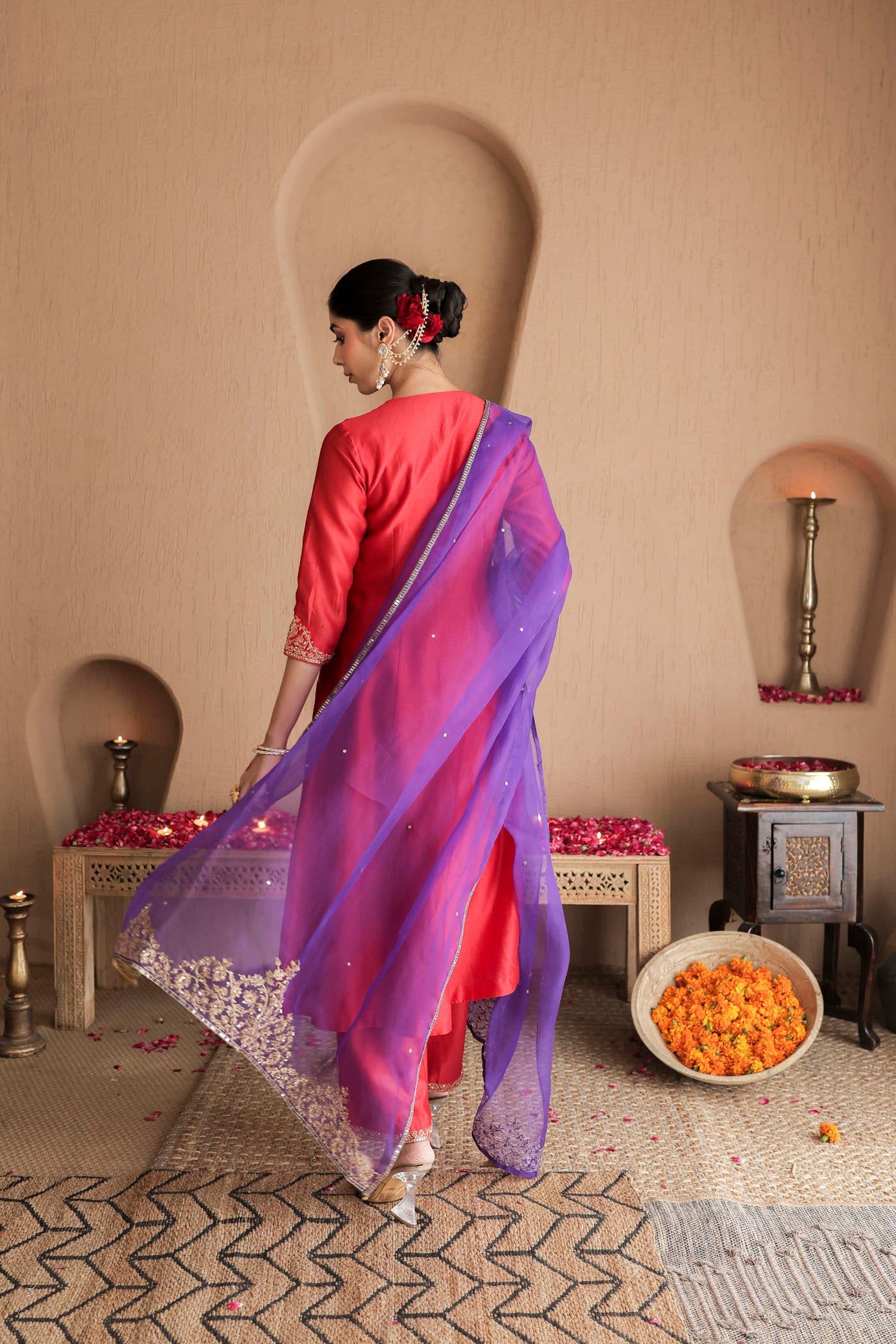 Red kurta set with purple dupatta and fine embellishments