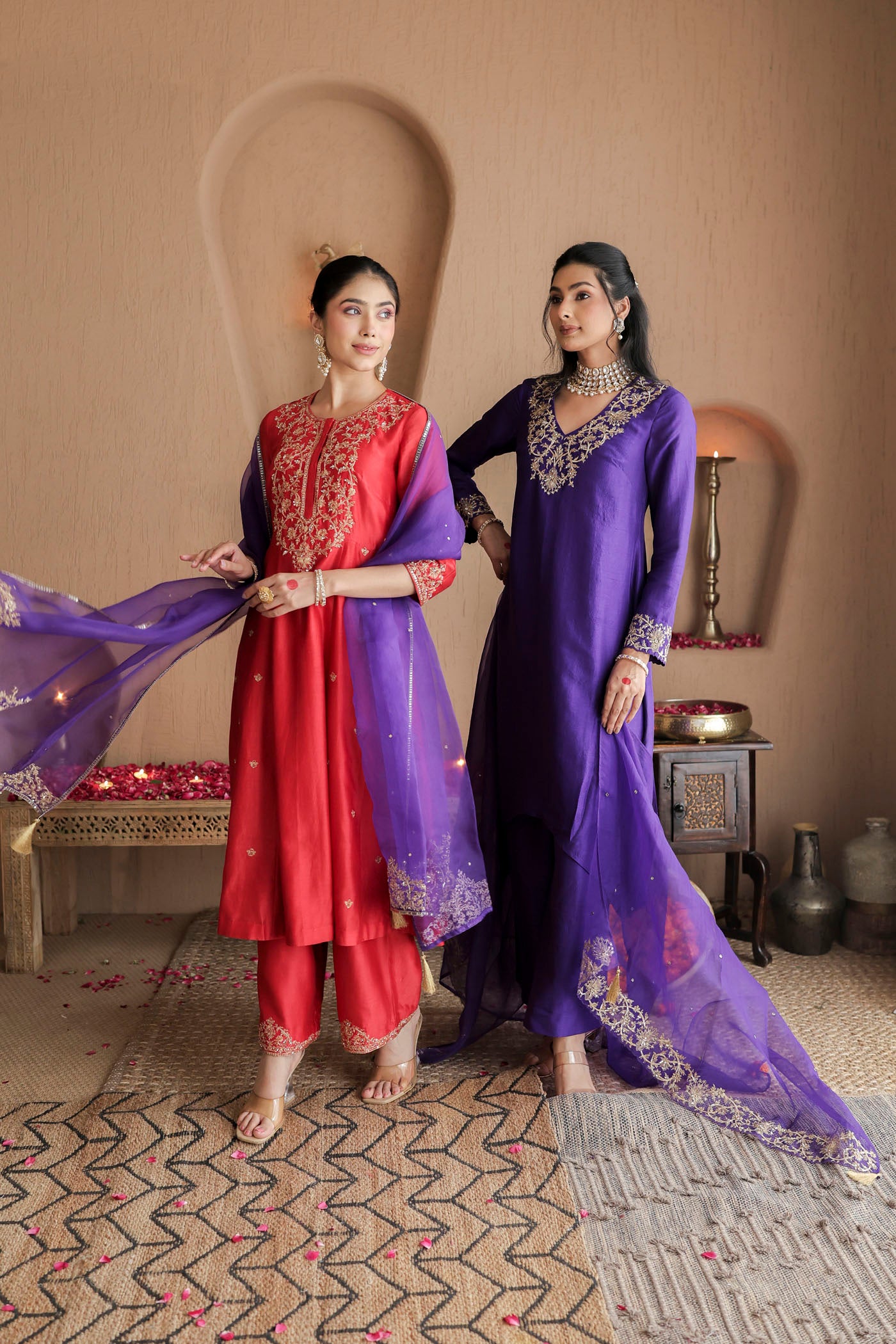 Red kurta set with purple dupatta and fine embellishments