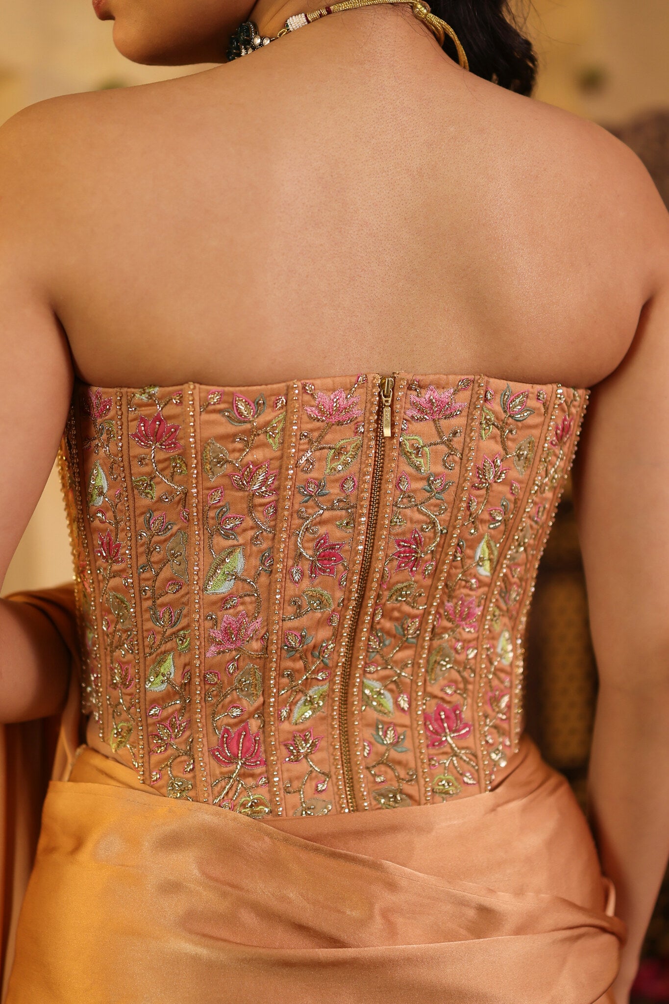 Soft Bronze Saree with Corset Blouse — embroidered corset detail, back