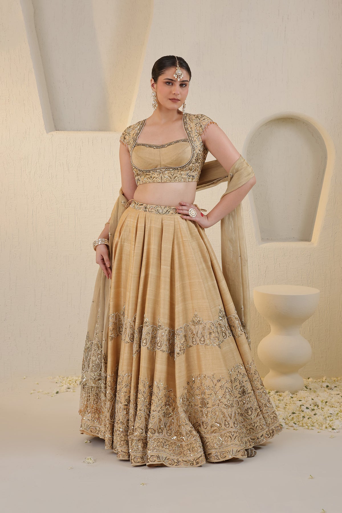 Champagne gold silk lehenga with gold embellishments