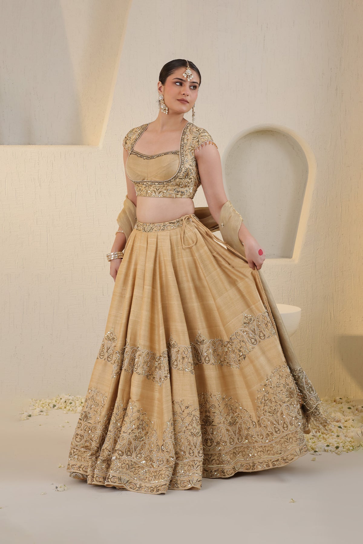 Champagne gold silk lehenga with gold embellishments