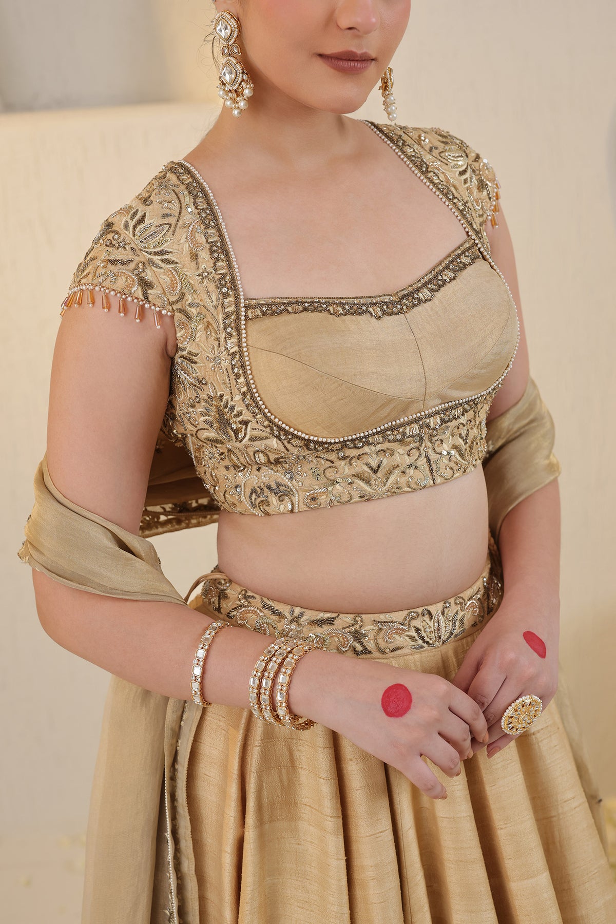 Champagne gold silk lehenga with gold embellishments