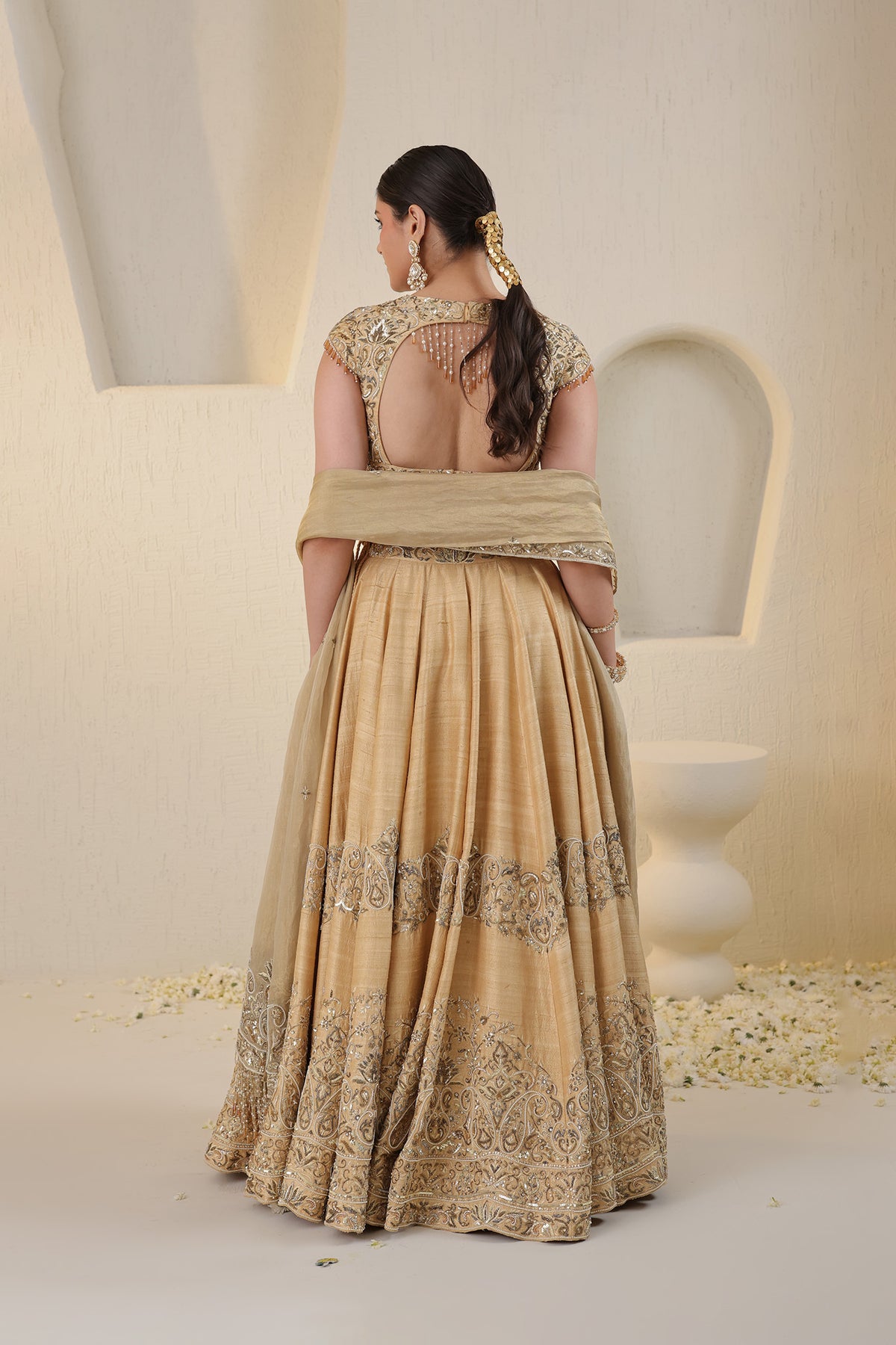 Champagne gold silk lehenga with gold embellishments