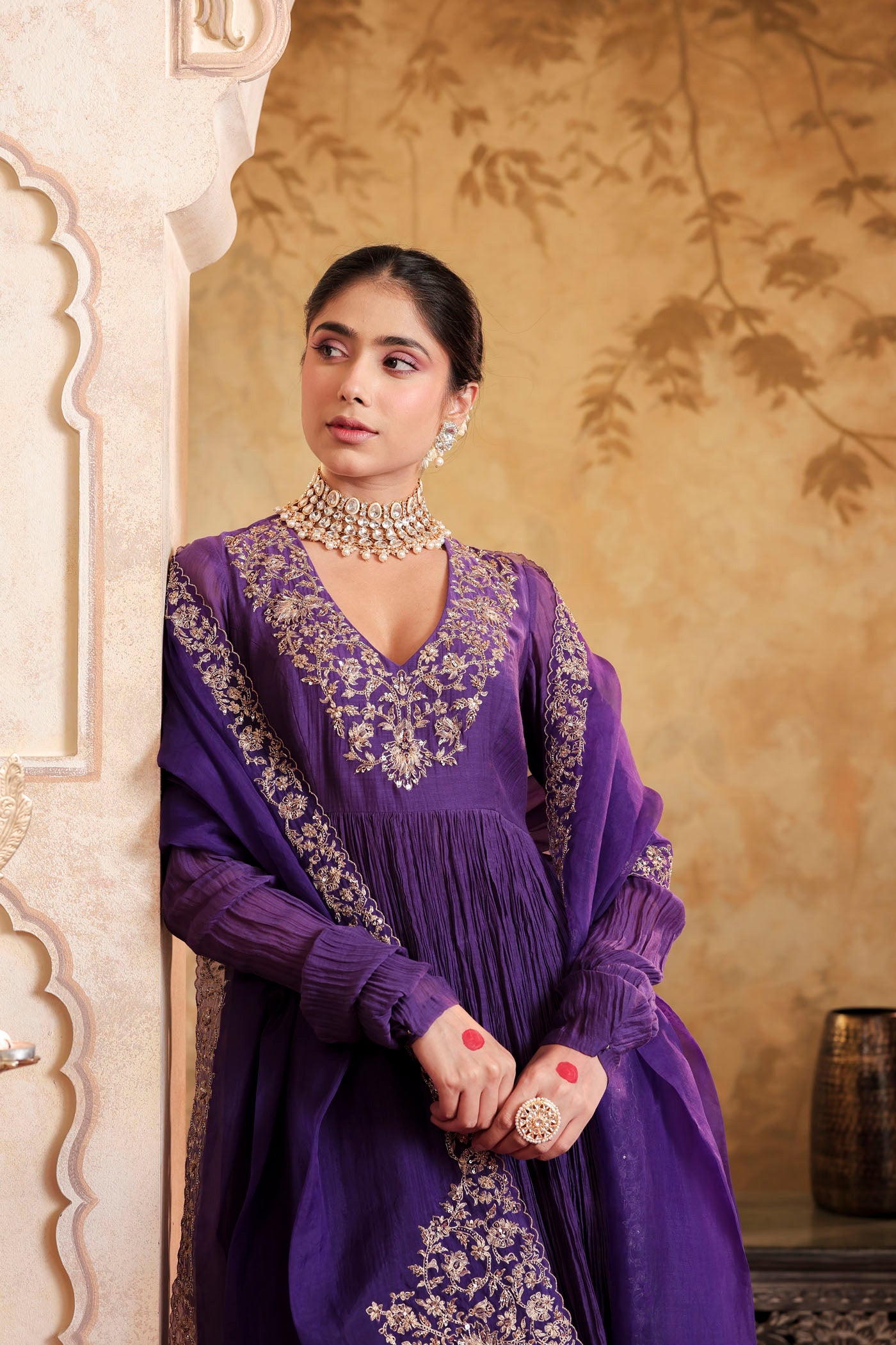 Royal purple anarkali woven with golden dreams
