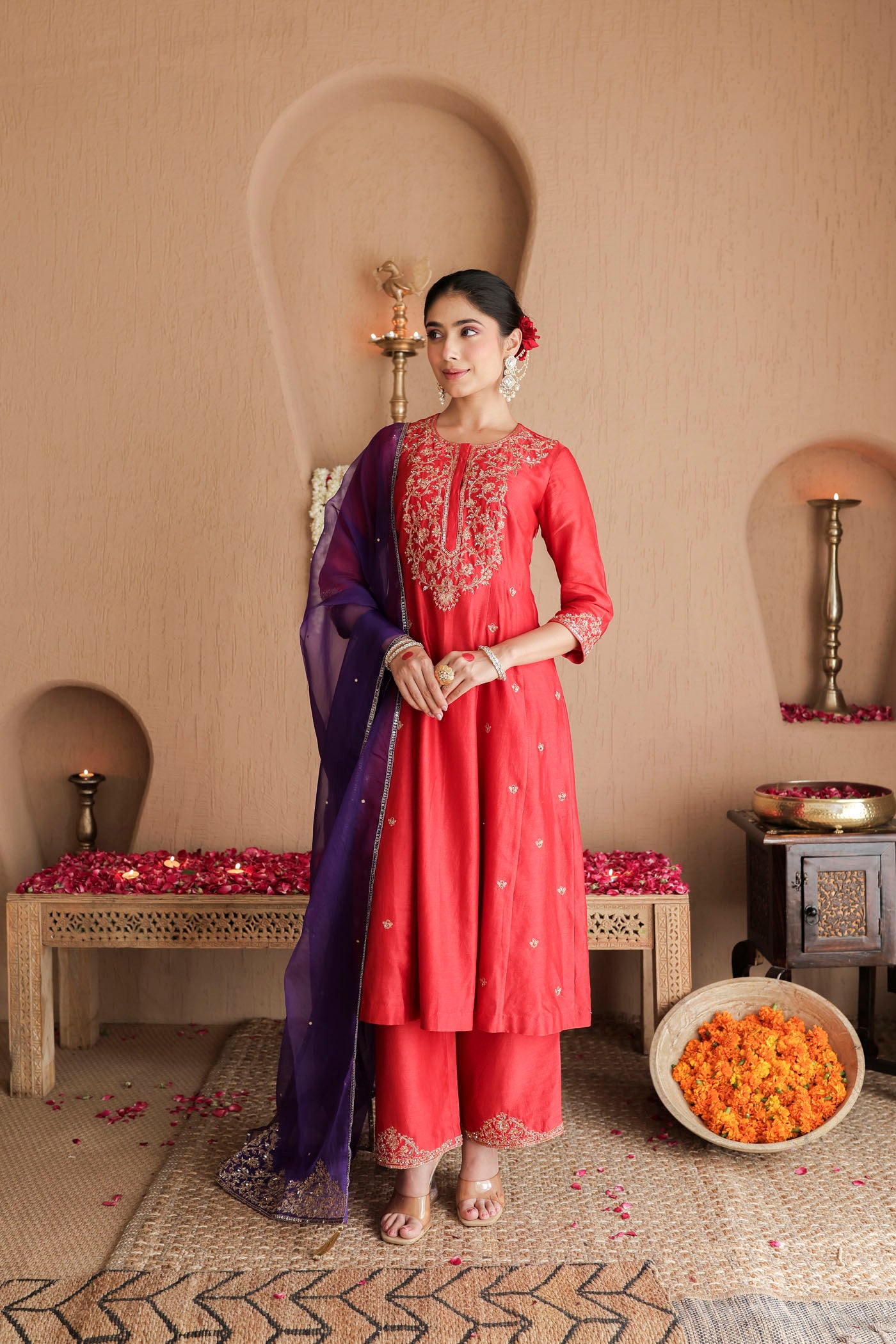Red kurta set with purple dupatta and fine embellishments