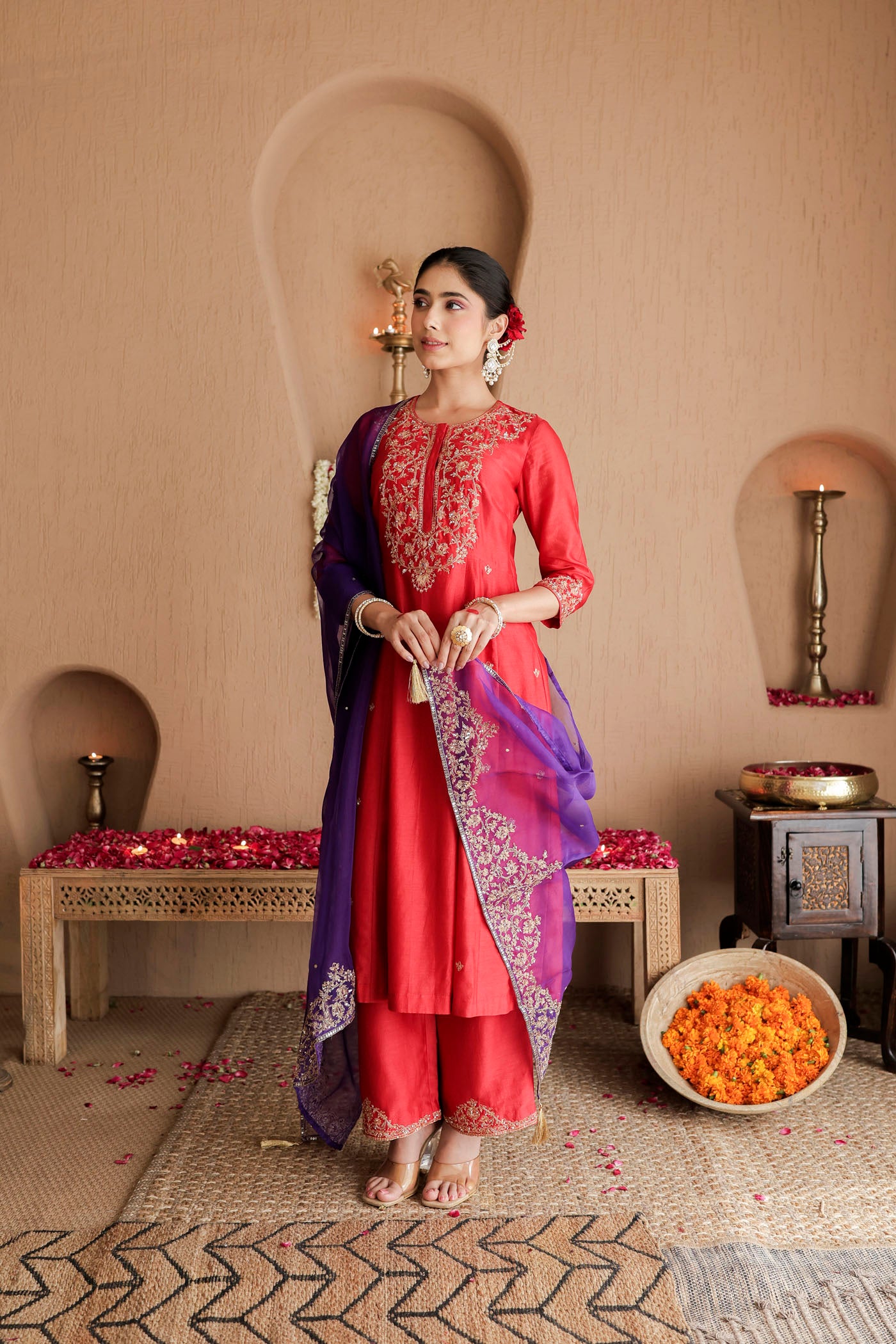 Red kurta set with purple dupatta and fine embellishments