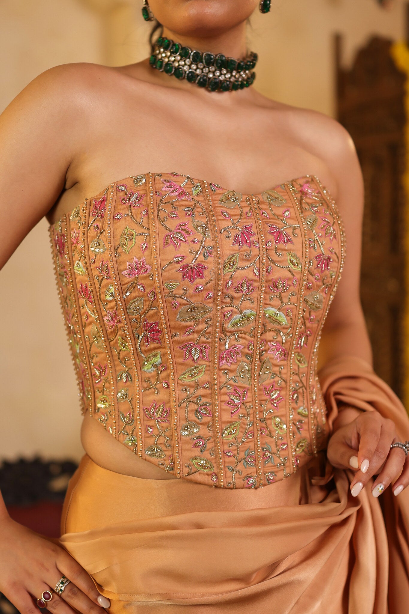 Soft Bronze Saree with Corset Blouse — embroidered corset detail, front